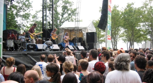 The Feelies spent last Fourth of July in Battery Park in NYC, opening for Sonic Youth. That's Yo La Tengo's Ira Kaplan in the lower right corner, just to the right of North Jersey singer-songwriter Ed Seifert in the white T-Shirt. (Copyright 2008, Steven P. Marsh)