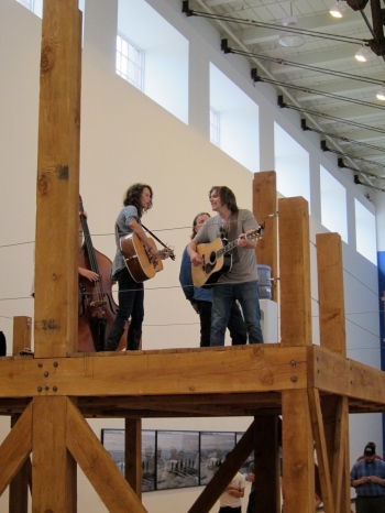 Sarah Lee Guthrie and Johnny Irion perform atop an artwork in a gallery at the Massachusetts Museum of Contemporary Art in North Adams, Mass., during the Solid Sound festival in 2011. (Photo © 2011, Steven P. Marsh)